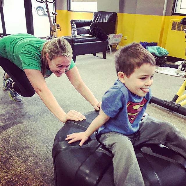 Lauren pushing Wyatt on the plate at group personal training #Denver #Denvermom #mom #baby #babies #kid #kids #children #fitness #gym #workout #colorado #personaltrainer #personaltraining #mother #child #sweat #fun #weights #dumbbells #squats #lean #moms #fatloss #calories #groupfitness #denvergym #cardio #core #superman