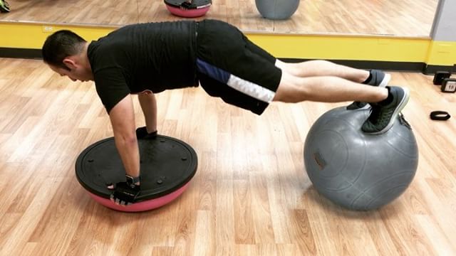 This is hard. Push-up on the bosu ball with feet on the stability ball #bootcamp #personaltrainer #gym #denver #colorado #fitness #personaltraining #trainerscott #getinshape #fatloss #loseweight #ripped #toned #chestpress #benchpress #chest #bench #chestday #pecs #arms #arm #armday #shredded #fitbabe #triceps #biceps #babe #strong #fitnessmodel